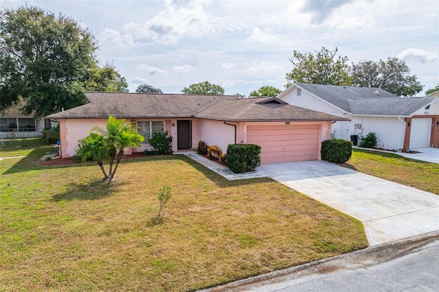 ranch-style home featuring a front yard and a garage