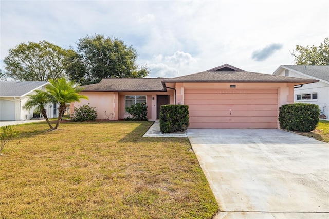 ranch-style home featuring a front lawn and a garage