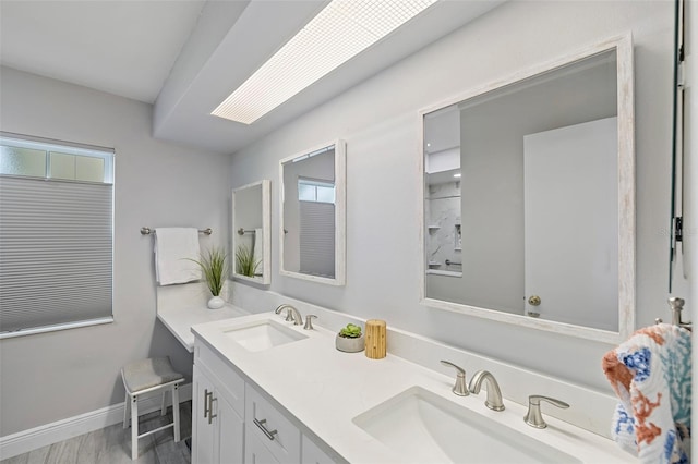 bathroom featuring vanity and wood-type flooring