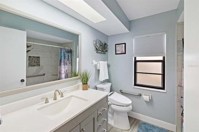 bathroom featuring vanity, hardwood / wood-style flooring, a shower with curtain, and toilet