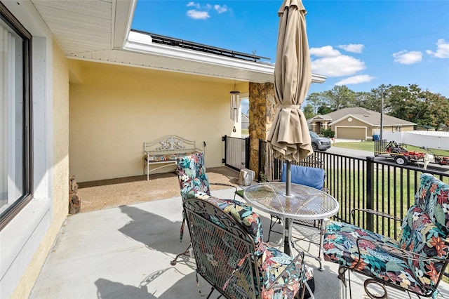 view of patio featuring outdoor dining area