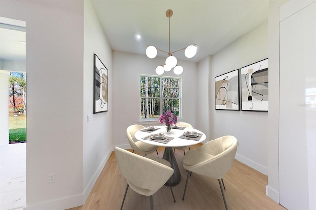 dining space with light hardwood / wood-style flooring