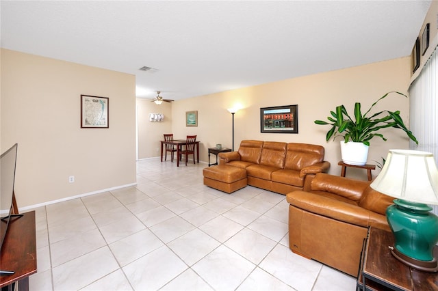 tiled living room featuring ceiling fan and a textured ceiling