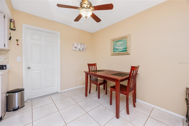 dining room featuring ceiling fan and light tile patterned floors