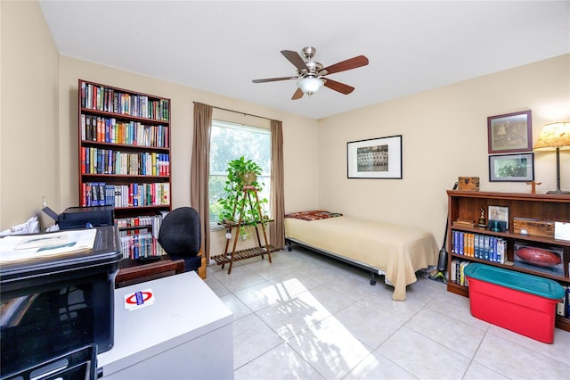 tiled bedroom featuring ceiling fan