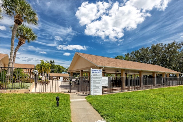 view of property's community featuring a yard