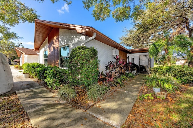 2390 Shelly Dr Unit D, Palm Harbor, FL 34684 - view of home's exterior featuring brick siding