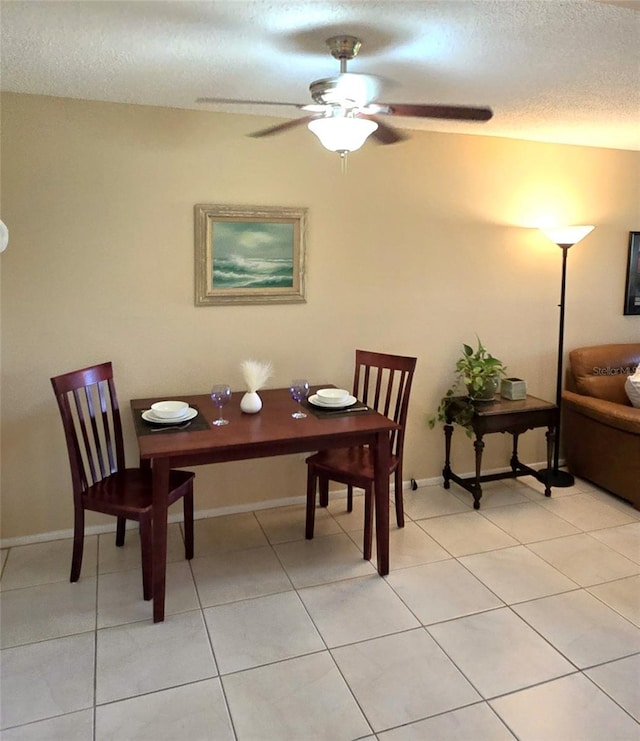 2390 Shelly Dr Unit D, Palm Harbor, FL 34684 - dining space featuring a textured ceiling, a ceiling fan, and light tile patterned floors