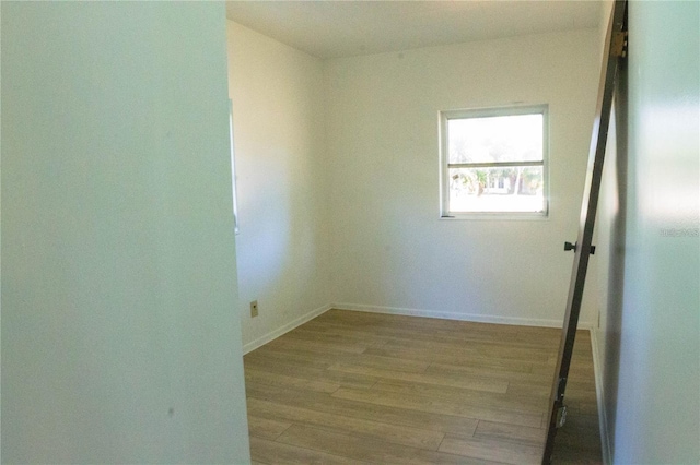 unfurnished room with light hardwood / wood-style flooring