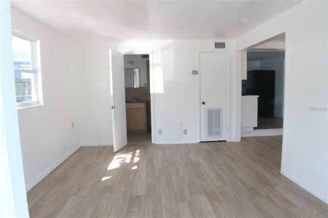 spare room featuring hardwood / wood-style floors