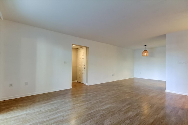 unfurnished room featuring wood-type flooring