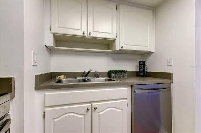 bar with white cabinets, stainless steel dishwasher, and sink