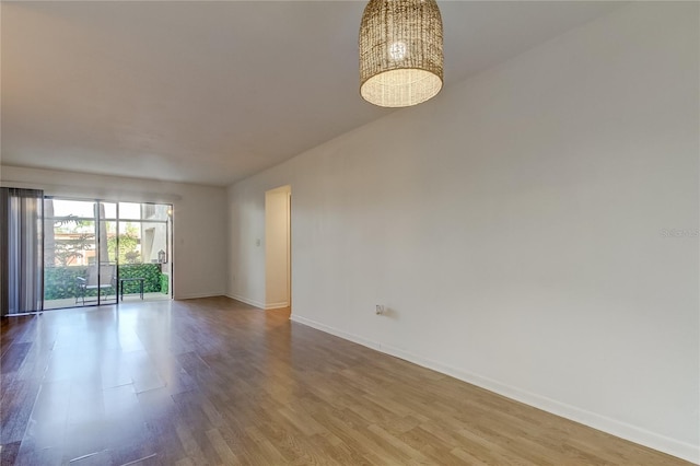 unfurnished room featuring wood-type flooring