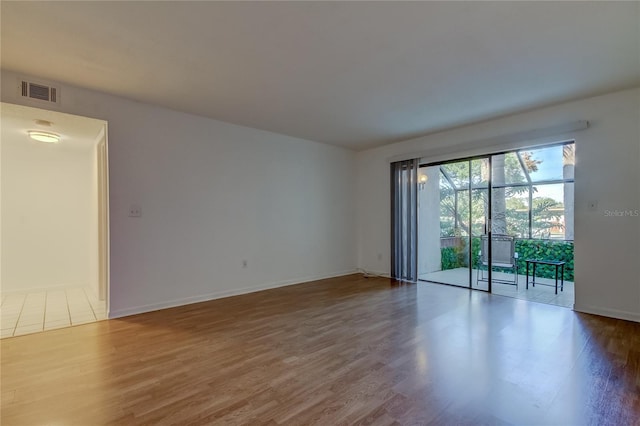 empty room featuring hardwood / wood-style flooring