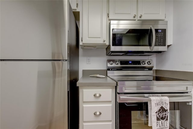 kitchen featuring white cabinetry and appliances with stainless steel finishes