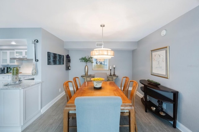 dining area with light hardwood / wood-style flooring