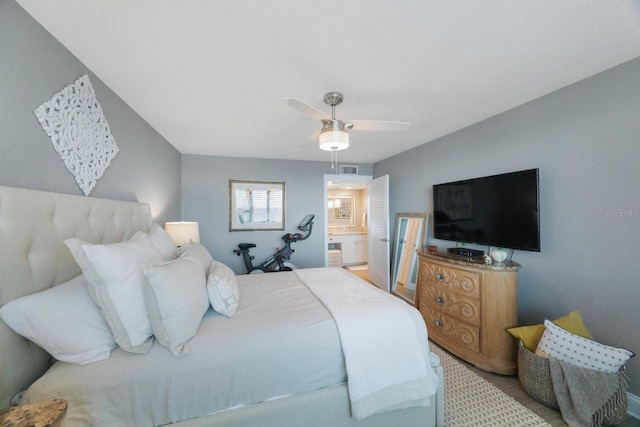 bedroom with ceiling fan and ensuite bathroom