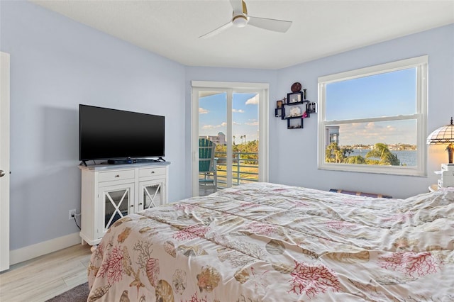 bedroom featuring light wood-type flooring, access to outside, and ceiling fan