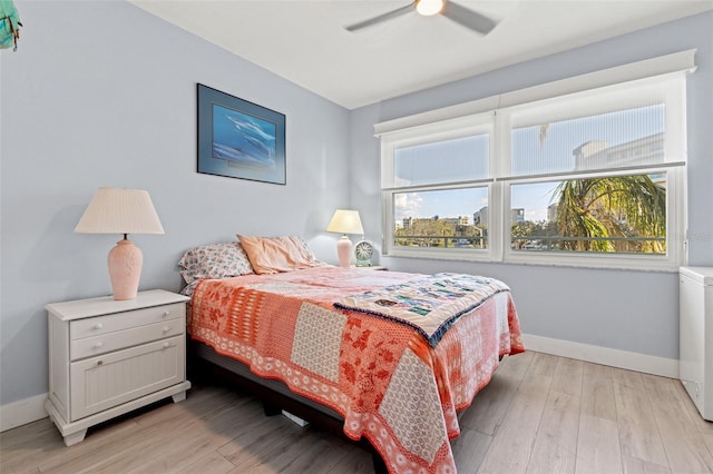 bedroom featuring light hardwood / wood-style floors and ceiling fan