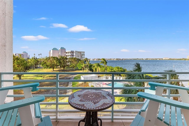 balcony featuring a water view