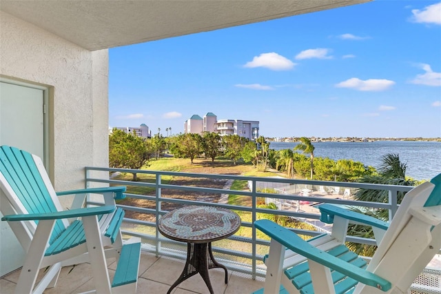 balcony featuring a water view