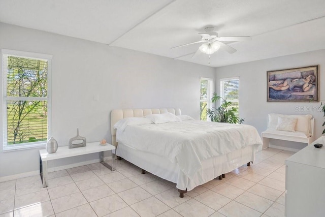 tiled bedroom with ceiling fan