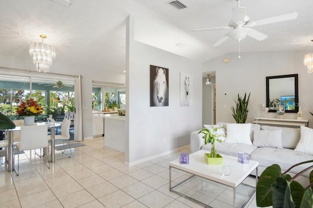 living room featuring ceiling fan with notable chandelier, lofted ceiling, and light tile patterned floors