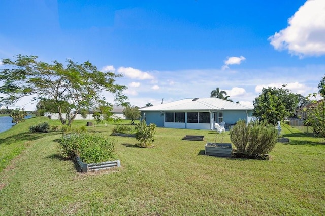 view of yard featuring a sunroom