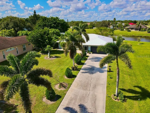 birds eye view of property featuring a water view