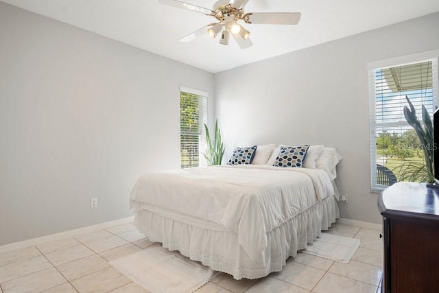 bedroom featuring light tile patterned floors and ceiling fan