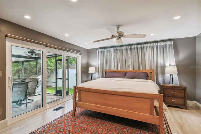 bedroom featuring hardwood / wood-style floors, ceiling fan, and access to exterior