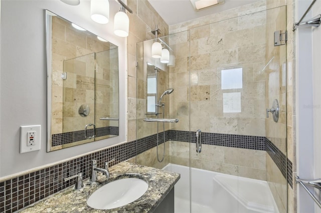 bathroom featuring decorative backsplash, vanity, and separate shower and tub