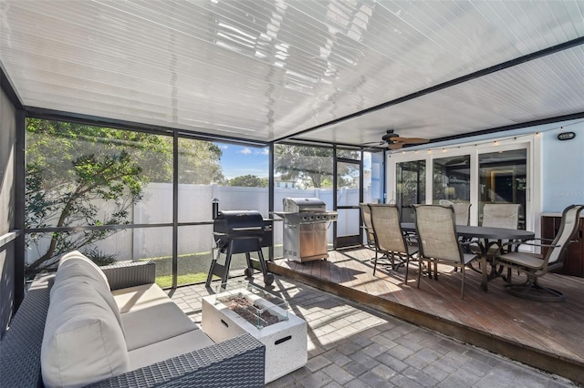 sunroom / solarium with ceiling fan