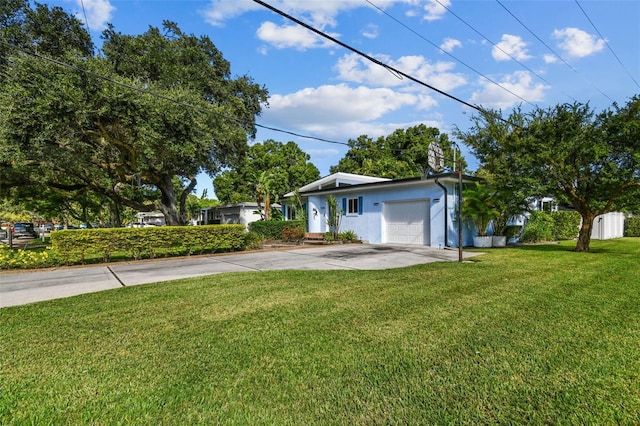 single story home with a garage and a front yard