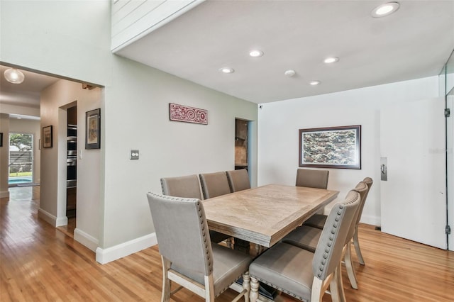 dining area with light hardwood / wood-style flooring