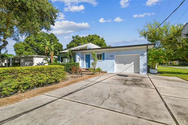 ranch-style house featuring a garage