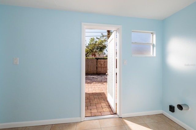 entryway with light tile patterned floors