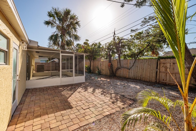 view of patio featuring a sunroom