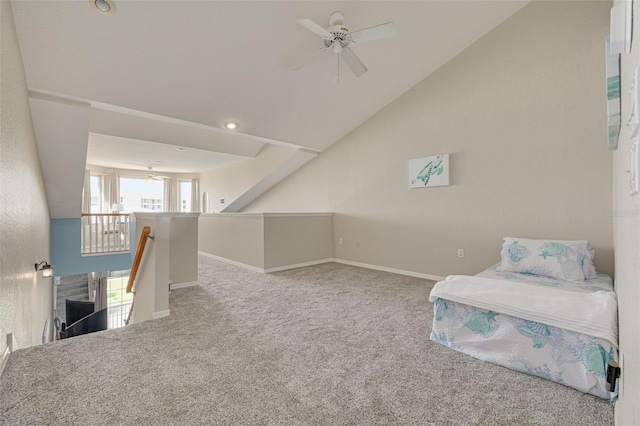 living area with ceiling fan, light colored carpet, and lofted ceiling