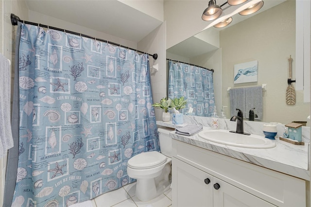 bathroom featuring vanity, toilet, and tile patterned floors