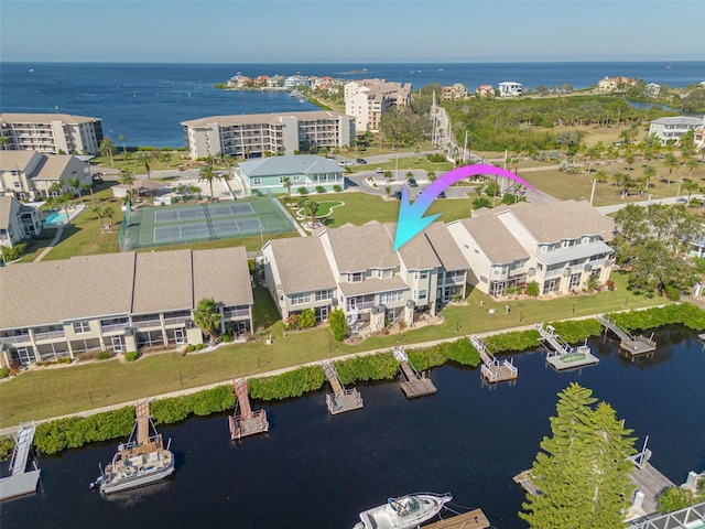 birds eye view of property featuring a water view