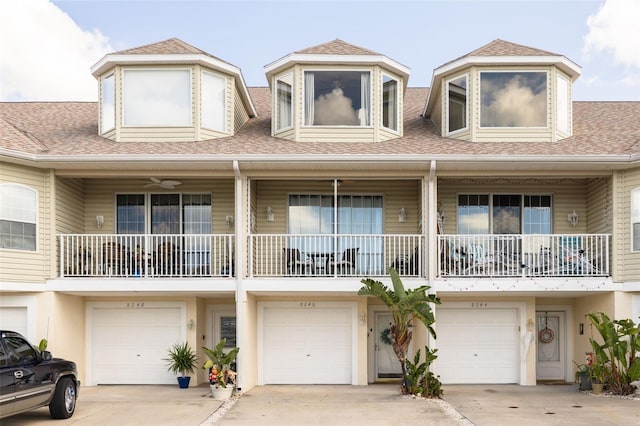 8246 Aquila St, Port Richey, FL 34668 - townhome / multi-family property featuring an attached garage, driveway, and a shingled roof