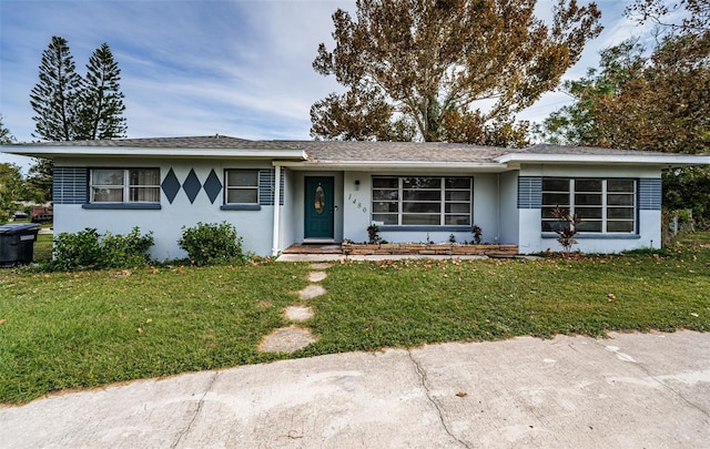 ranch-style house with a front yard