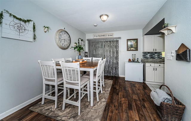 dining area featuring dark hardwood / wood-style floors