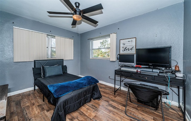 bedroom with hardwood / wood-style flooring and ceiling fan