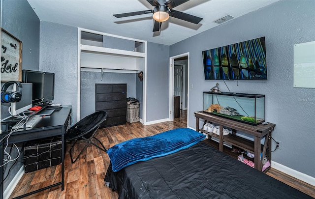 bedroom featuring a closet, ceiling fan, and wood-type flooring