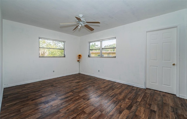 unfurnished room featuring ceiling fan and dark hardwood / wood-style flooring