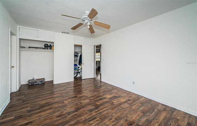 unfurnished bedroom featuring dark hardwood / wood-style flooring and ceiling fan