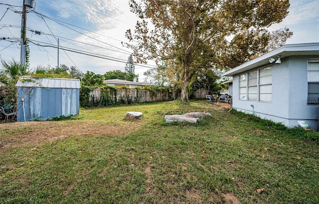 view of yard with a storage shed