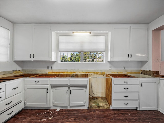 kitchen with white cabinets and dark hardwood / wood-style floors